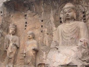 The Vairocana statue at the Longmen Grottoes, modeled after the central Buddha of the Avatamsaka Sutra, which honors Wu Zetian in its donative inscription. From wikimedia.org
