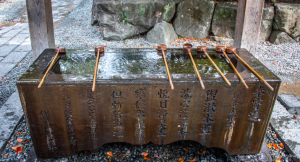 Temizuya: water basin to purify body, speech, and mind at Kotokuin Temple in Yokohama. From flickr.com