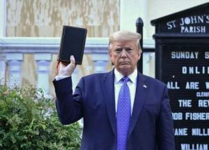 Donald Trump holds up a Bible at St. John's Church in Washington, DC. From axios.com