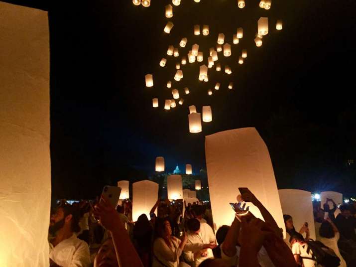 Lighting sky lanterns at Borobudur. Image courtesy of the author