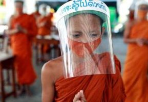 Novice monks wear face shields and protective masks during a lesson at the Wat Molilokkayaram monastic educational institute in Bangkok. From bangkokpost.com