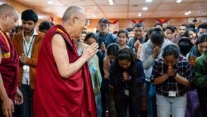 The Dalai Lama greets students. From dalailama.com