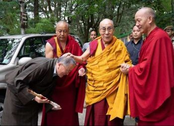 His Holiness the Dalai Lama is greeted by former Kalön Tripa, Tenzin Namgyal Tethong, as he makes his way from his residence to the main temple in the Tsuglakhang complex. Photo by Tenzin Choejor. From dalailama.com