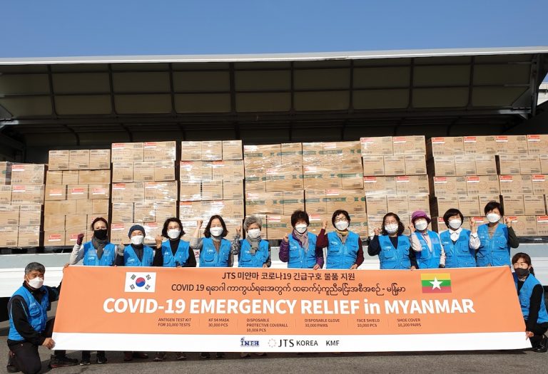 JTS Korea volunteers pose with the shipment of COVID-19 relief supplies ready to be shipped to Myanmar. Image courtesy of JTS Korea
