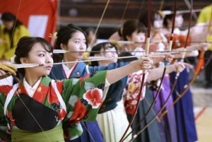 Women shoot arrows during the New Year Ohmato Taikai archery contest at Sanjusangen-do in Kyoto. From japantoday.com