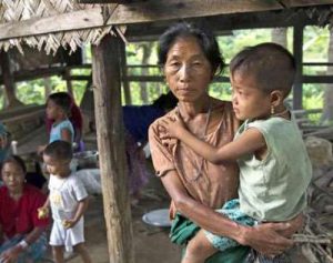 A displaced resident, a member of the Myo ethnic group, with her child at a Buddhist monastery in Kantharyar village in Rakhine State. From refworld.org