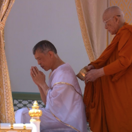 Thailand’s King Maha Vajiralongkorn undergoes a purification ritual before being crowned. From reuters.com