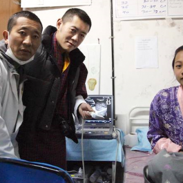 Bhutanese prime minister Lyonchhen Lotay Tshering, left, a trained urologist, has continued to treat patients since taking office. From mothership.sg