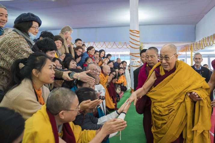 His Holiness the Dalai Lama greets well-wishers as he arrives at the Kalachakra Maidan on Sunday. The Dalai Lama is expected to remain in Bodh Gaya until 2 February. From dalailama.com