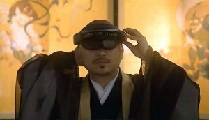 Kennin-ji monk Shundo Asano, whose image was used for the MR experience, dons a HoloLens headset. From youtube.com