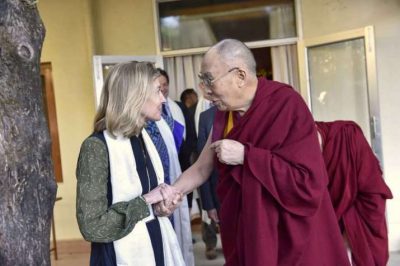 His Holiness exchanges greetings with United States Institute of Peace president Nancy Lindborg at his official residence in Dharamsala. From dalailama.com
