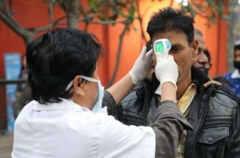 A health worker conducts temperature checks at the India-Bhutan border. From Prime Minister's Office - PMO, Bhutan Facebook