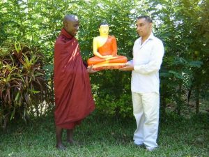 Ven. Buddharakkitha receiving a Buddha statue in Sri Lanka. From Ven. Ugandawe Buddharakkitha