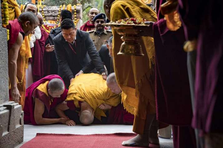 His Holiness prostrates to the Buddha before entering Mahabodhi Temple. From dalailama.com