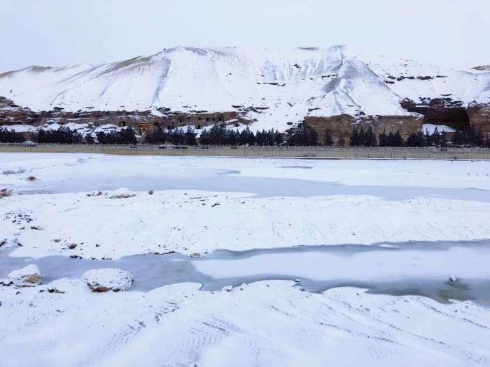 The Mogao Caves at Dunhuang, in winter snow. From en.dha.ac.cn