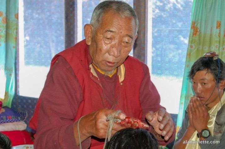 Lama Geshe blessing Sherpas. From alanarnette.com