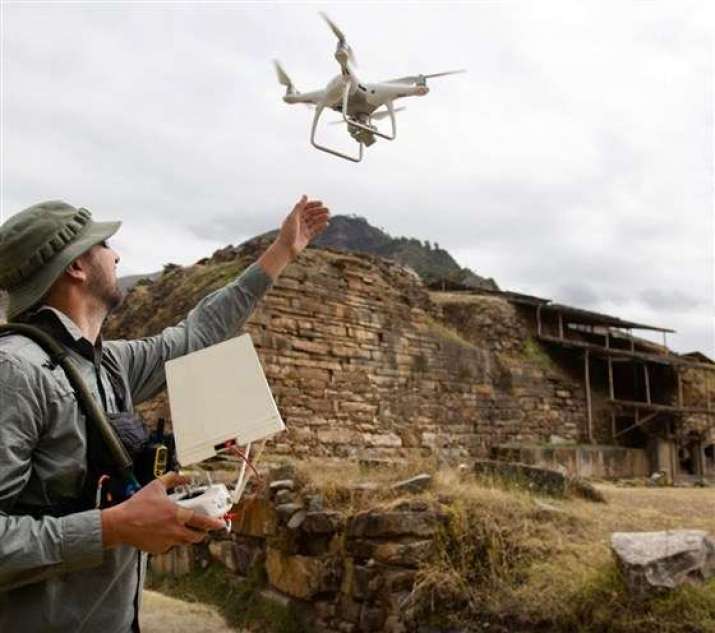 A CyArk specialist uses a drone to take photogrammetry images at Chavin de Huantar, in Peru. Image credit CyArk/Open Heritage