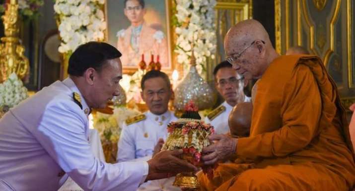 Somdet Phra Maha Muniwong, right, is invited to become supreme patriarch of Thailand's monastic sangha by office minister Omsin Chivapruek. From thenation.com