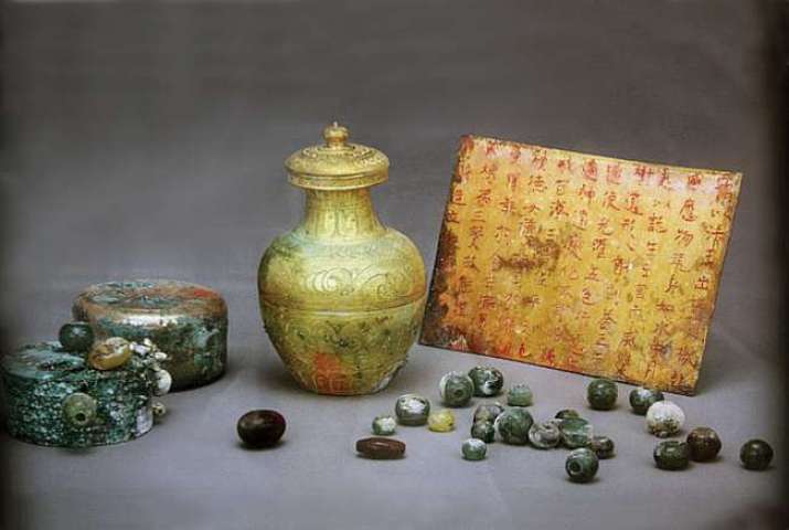 A <i>sarira</i> container and other artifacts found inside the stone pagoda. From koreaherald.com