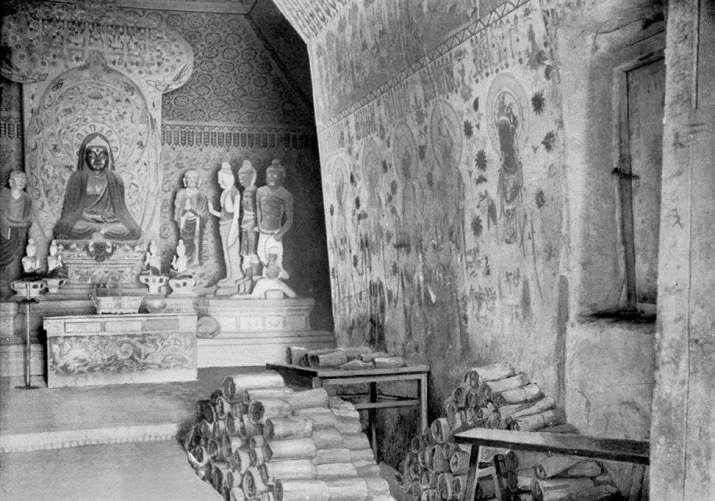 Aurel Stein’s 1907 view of Mogao Cave 16, with a portion of the manuscripts from Cave 17. From pinterest.com