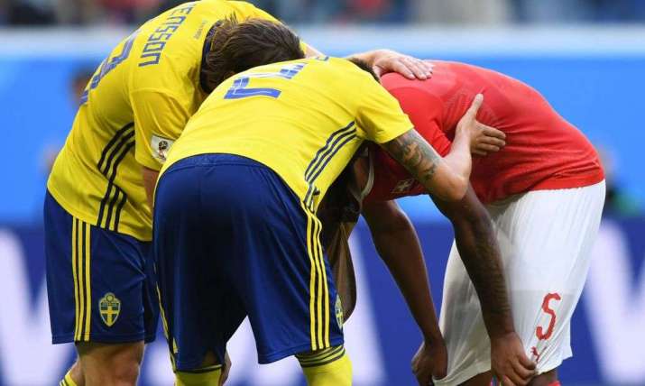 Swedish players comfort a distraught Manuel Akanji, Switzerland’s center-back, after the ball ricocheted off his foot into his own team’s goal. From ftw.usatoday.com