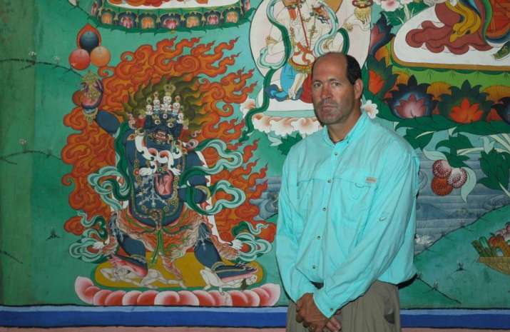 Chana Dorje mural and Mike Borre. Bhutan, 2006. Photo by Gerard Houghton. From Core of Culture