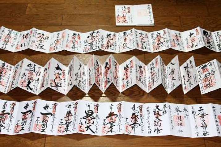 <i>Goshuin-cho</i> filled with stamps. From kyotoursjapan.com
