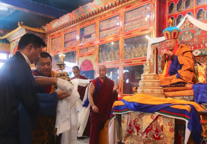 CTA president Dr. Lobsang Sangay makes an offering to the 34th Menri Trizin during the enthronement ceremony. From phayul.com