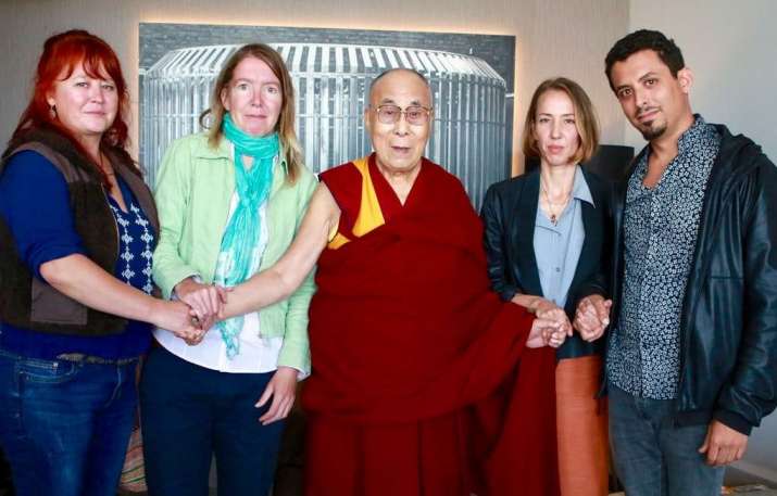 The Dalai Lama poses with the four petitioners. Photo by Marlies Bosch. From lionsroar.com
