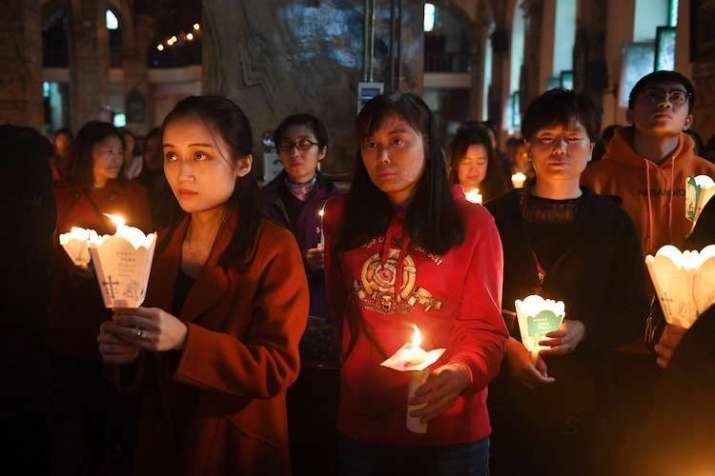 Catholic worshippers attend Mass on Holy Saturday at the government-sanctioned South Cathedral in Beijing. Photo by Greg Baker. From ucanews.com