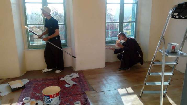 Monks work on renovating the center before the start of the 90-day winter retreat on 17 November. From healingspringmonastery.org