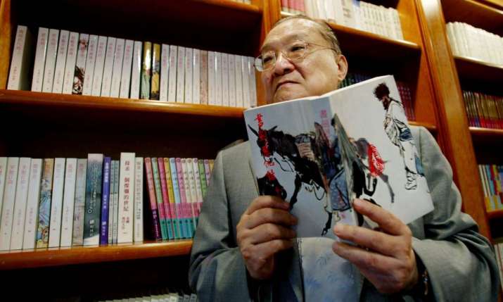 Novelist Louis Cha pictured in 2002. Photo by Bobby Yip. From theguardian.com