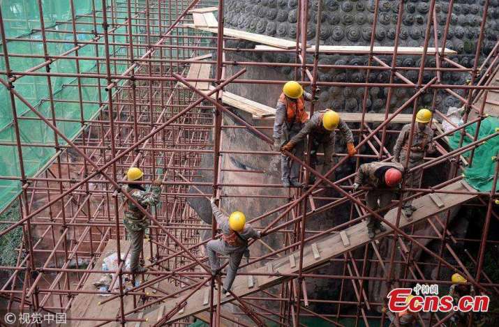 The Leshan Buddha covered in scafolding. From ecns.cn