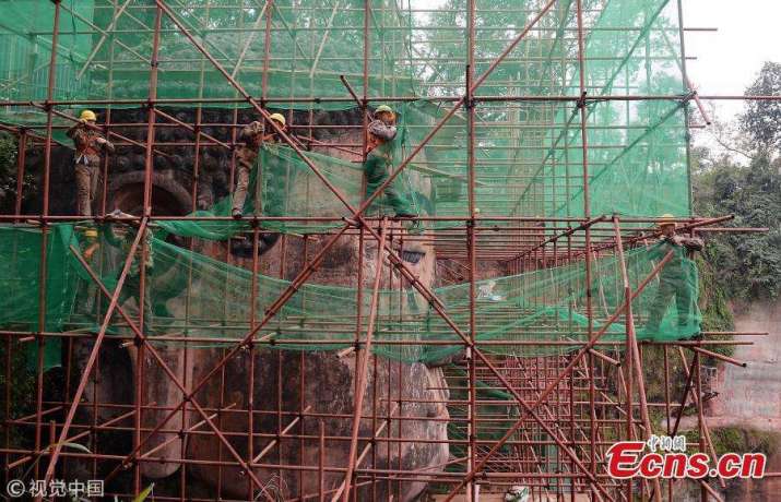 The Leshan Buddha covered in scafolding. From ecns.cn