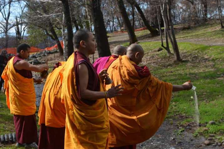 Five monks from Gaden Shartse Cultural Foundation perform a blessing in Paradise, California. From chicoer.com