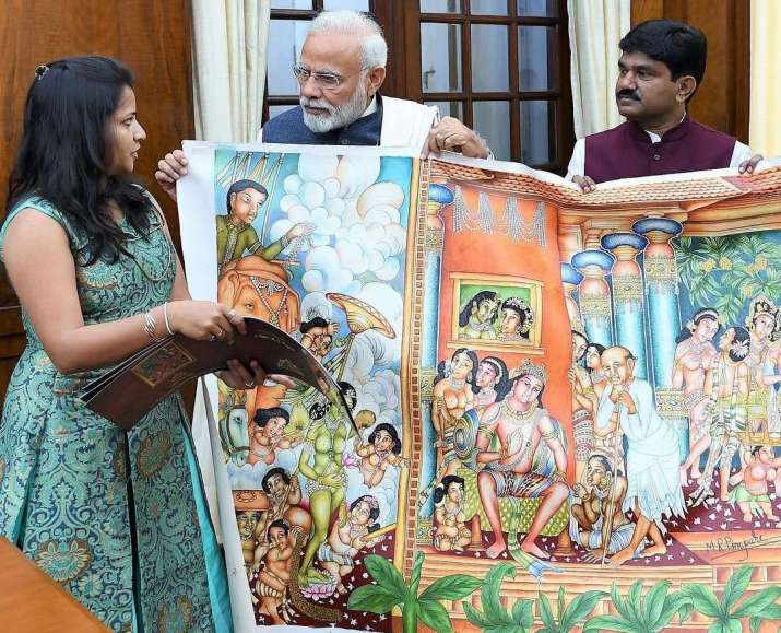 Mayura Pimpare shows her father's work to Indian prime minister Narendra Modi. Image courtesy of Mayura Pimpare