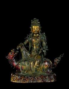 Guanyin Bodhisattva seated on lion mount, China, Ming dynasty, 15th century. From ckh.com.hk