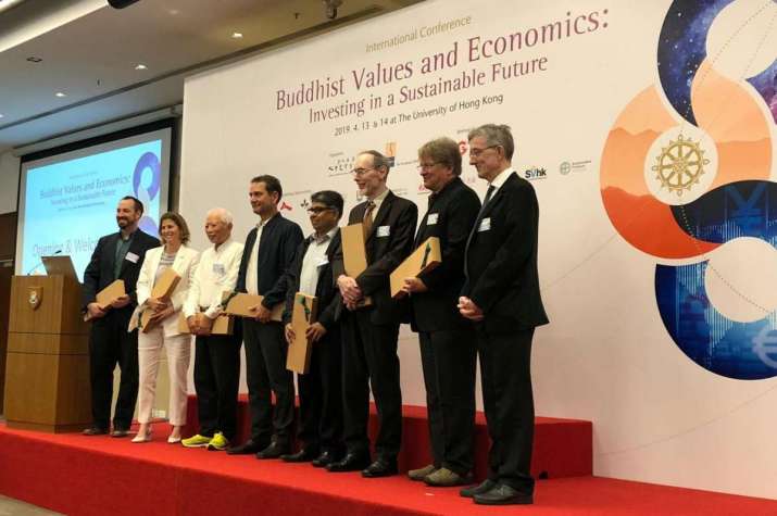 Presenters receive gifts at the opening of the Buddhist Values and Economics conference. Image courtesy of Raymond Lam
