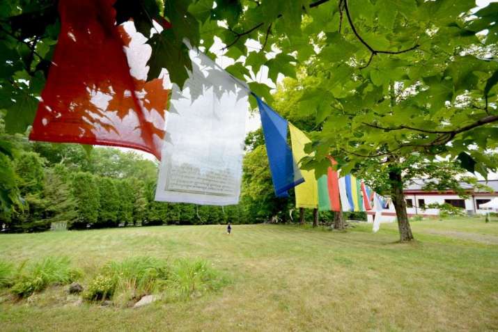 Karma Triyana Dharmachakra yard and prayer flags. Photo by Annika Lundkvist