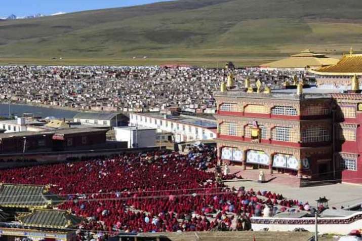 Monastics at Yarchen Gar attend <i>puja</i>. From tibetantrekking.com.jpg