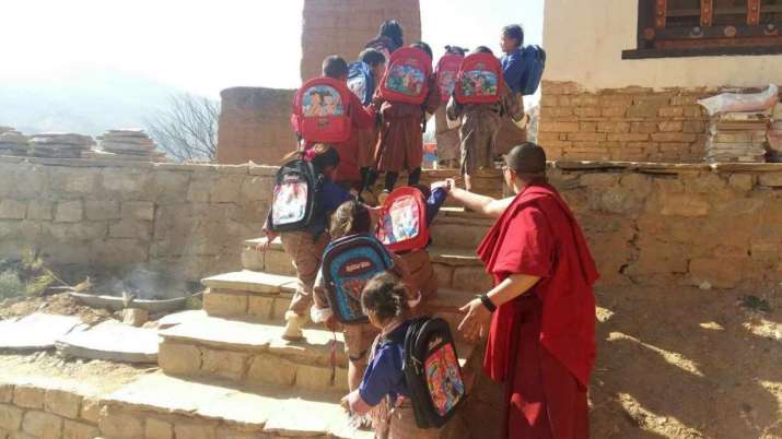 The children arrive at the TRC with their school bags. Image courtesy of the BNF