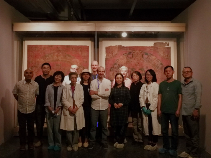 Dr. David Pritzker with the curatorial team in Dunhuang. Image courtesy of Pritzker Art Collaborative