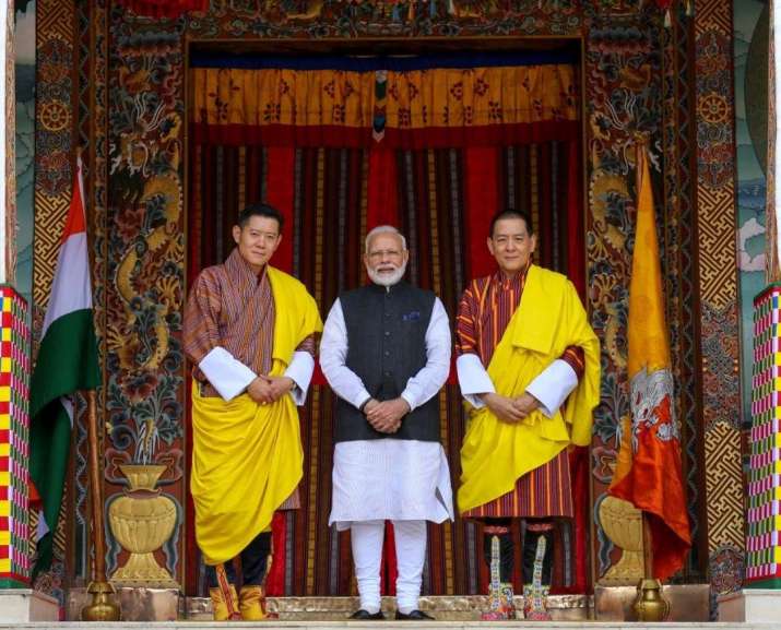 His Majesty the King of Bhutan Jigme Khesar Namgyel Wangchuck, left, and His Majesty the Fourth Druk Gyalpo, right, with Indian Prime Minister Narendra Modi in Tashichho Dzong. From facebook.com
