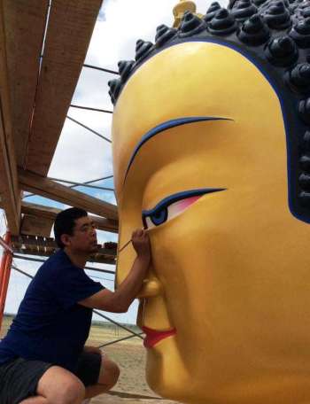 Jigme Lodoy opening the eyes of Maitreya statue. From facebook.com