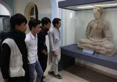 Students view a statue at the National Museum in Kabul. From reuters.com
