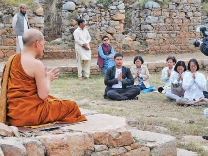 Ven. Arayawangso talks about the importance of the Bahmala Stupa and stops to meditate at the site. From tribune.com.pk