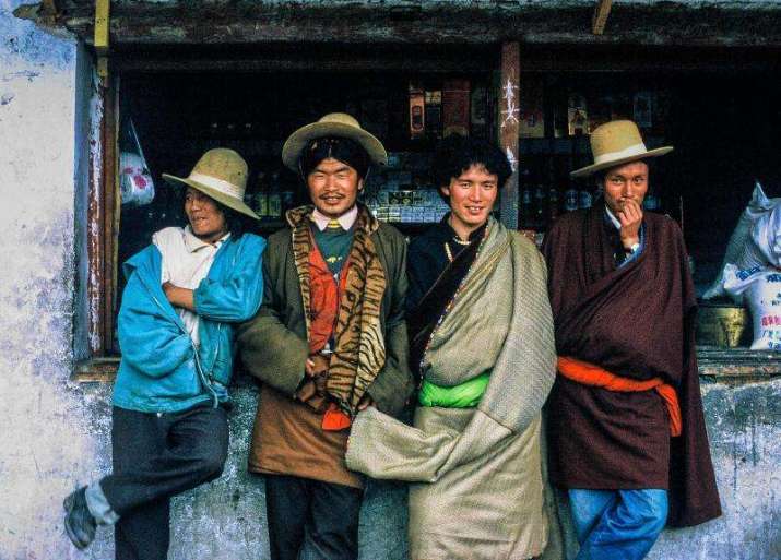 Bashful nomad cowboys came to town, strutting their macho stuff until I pursued them with a camera and then they came over all shy. Dechen, Kham, 2000. Photo by Diane Barker