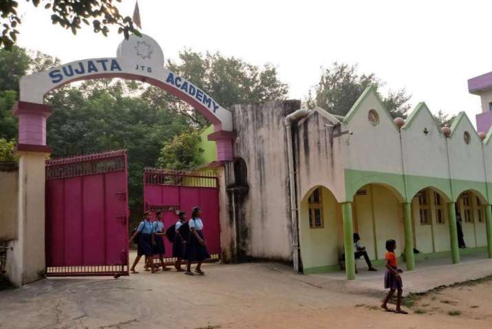 Students at the main gate of the Sujata Academy. Image courtesy of JTS India