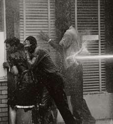 Teenagers in Birmingham, Alabama, are shot with water hoses, 1963. From wikipedia.org