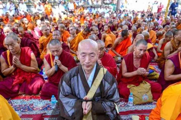 Buddhist monks of different traditions gather under the Bodhi tree in Bodh Gaya on the occasion of the birth anniversary of the Buddha. From outlookindia.com